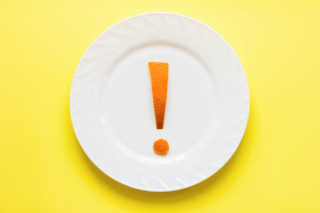 exclamation mark on a plate. healthy eating concept. weight loss strategy.