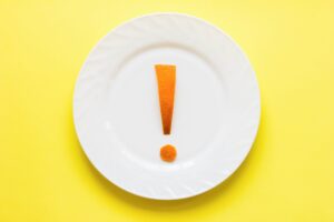 exclamation mark on a plate. healthy eating concept. weight loss strategy.