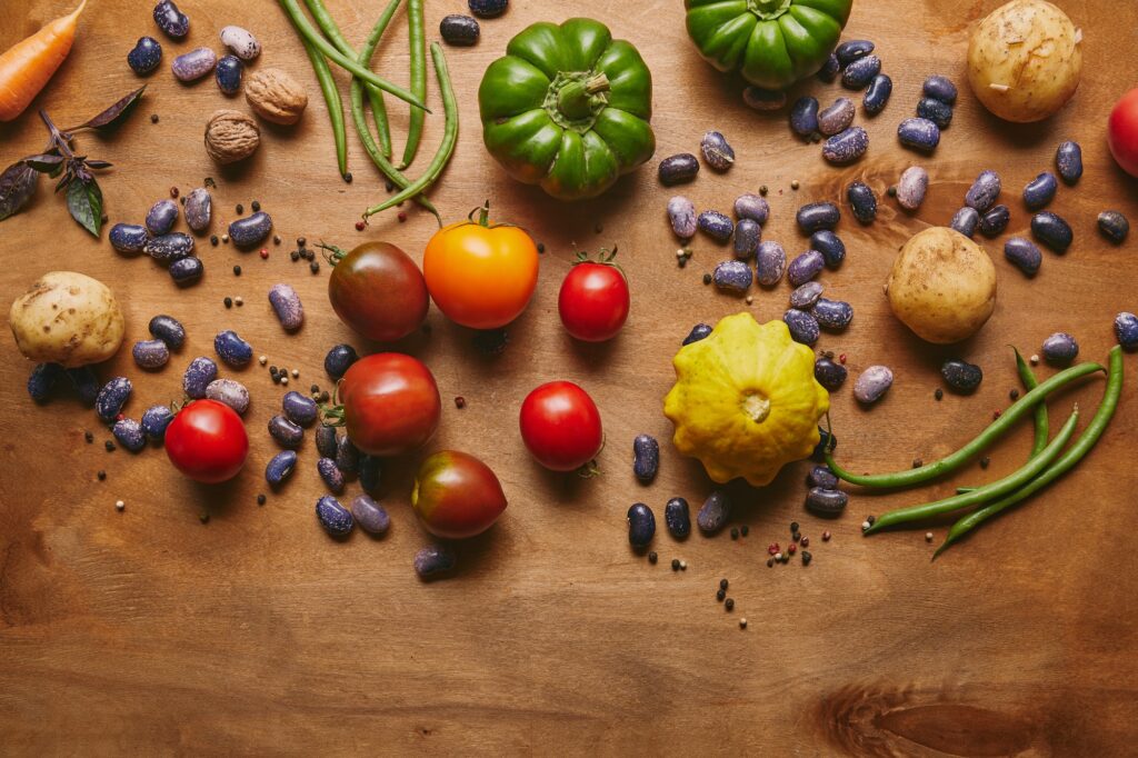 Whole food template with natural vegetables on wooden table
